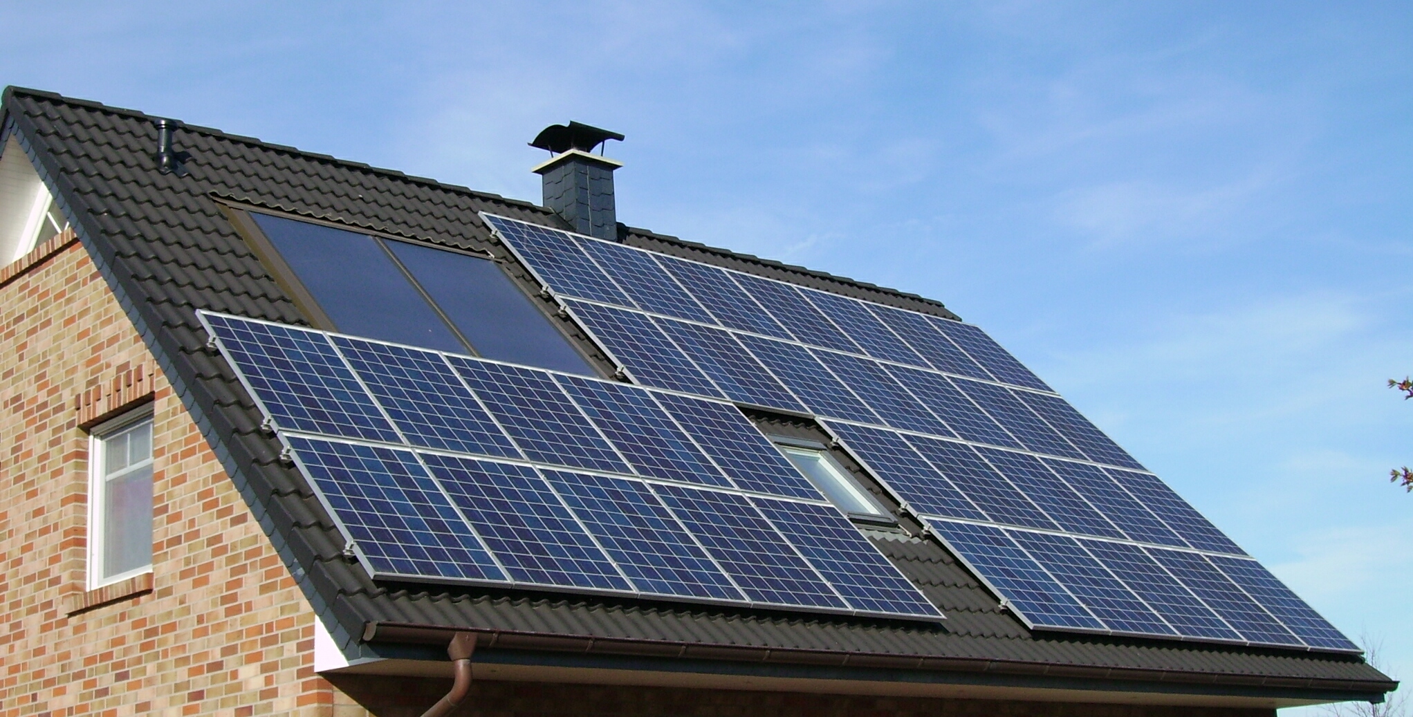 Solar panels mounted across a residential roof